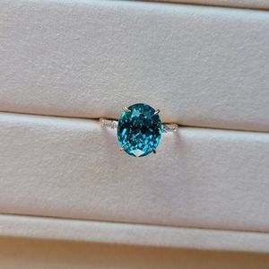 Solid 14k gold 8.5ct lab paraiba ring with side lab diamond